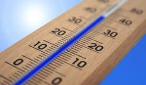The thermometer shows a high temperature in the sun